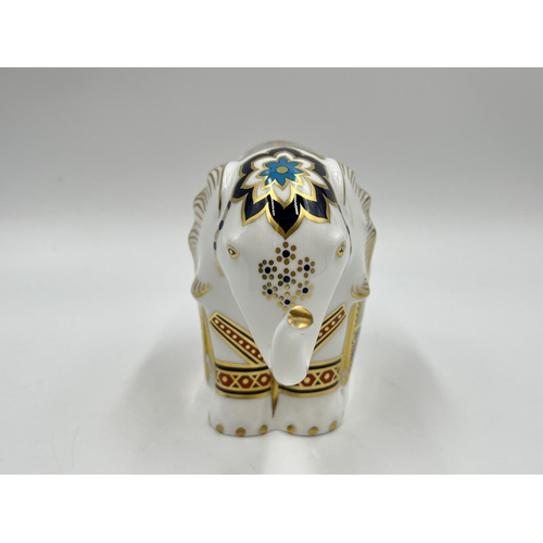 253 - A boxed Royal Crown Derby Elephant paperweight with gold stopper