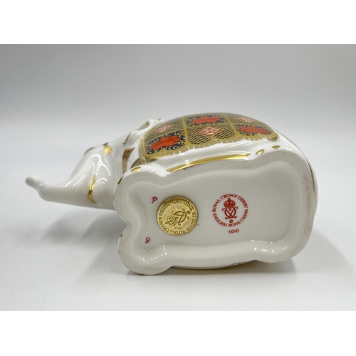 253 - A boxed Royal Crown Derby Elephant paperweight with gold stopper