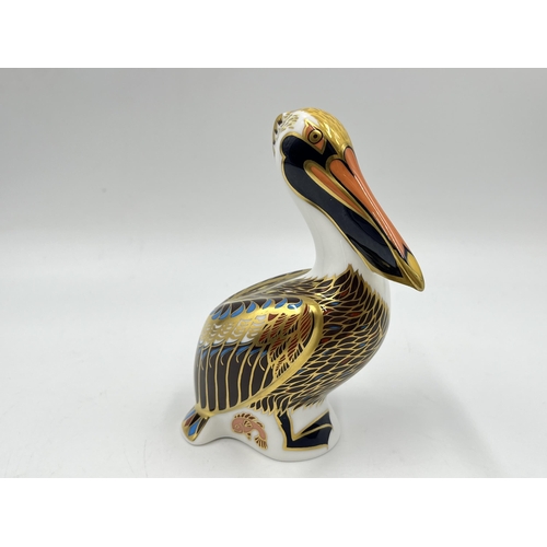 257 - A boxed Royal Crown Derby Brown Pelican paperweight with gold stopper