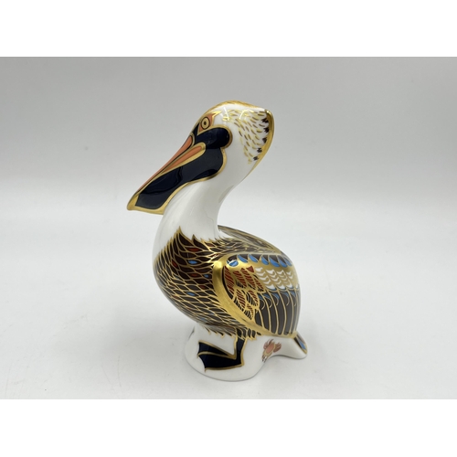 257 - A boxed Royal Crown Derby Brown Pelican paperweight with gold stopper