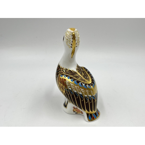 257 - A boxed Royal Crown Derby Brown Pelican paperweight with gold stopper