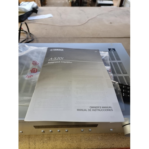 721 - A Yamaha A-S201 natural sound integrated amplifier with remote control and instruction manual