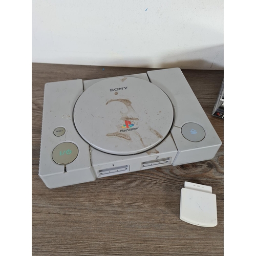 796 - A Sony PlayStation with five games to include Tony Hawk's Pro Skater II, Tomb Raider Chronicles, The... 