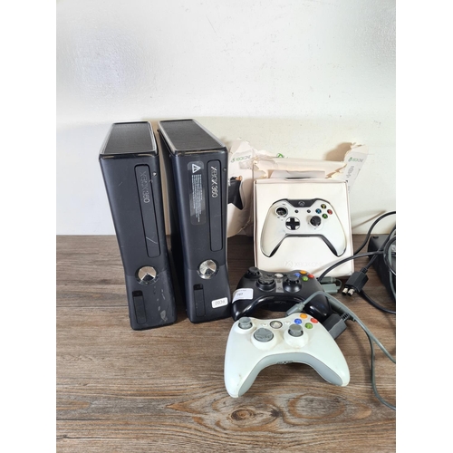 797 - Five Microsoft Xbox items, two Xbox 360s with power packs, two Xbox 360 controllers and one boxed Xb... 