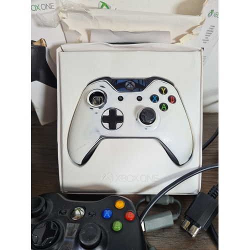 797 - Five Microsoft Xbox items, two Xbox 360s with power packs, two Xbox 360 controllers and one boxed Xb... 