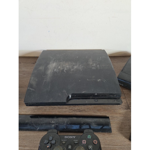 801 - Five Sony PlayStation 3 items, three consoles and two controllers