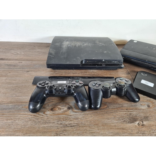 801 - Five Sony PlayStation 3 items, three consoles and two controllers