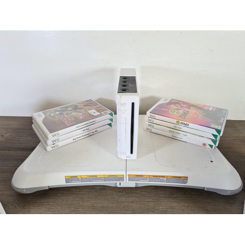 802 - A collection of Nintendo Wii games consoles, games and accessories to include five consoles, seven g... 