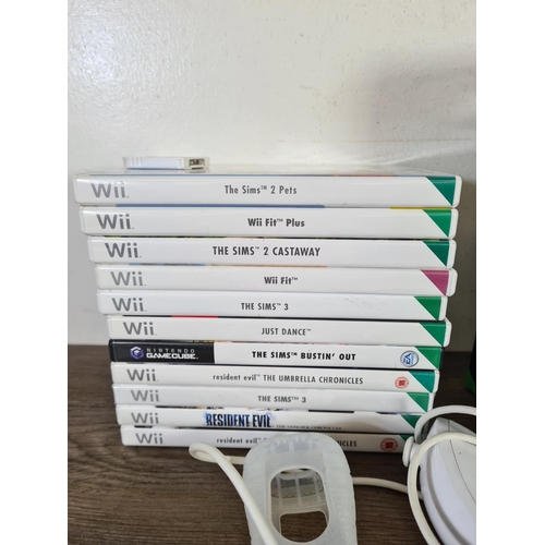 804 - A collection of gaming accessories to include ten Nintendo Wii games, boxed Turtle Beach Ear Force R... 