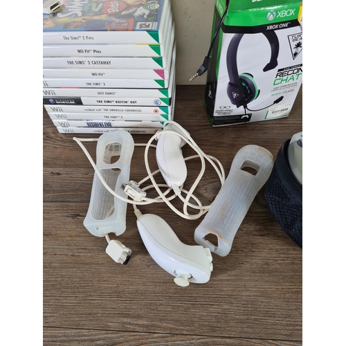 804 - A collection of gaming accessories to include ten Nintendo Wii games, boxed Turtle Beach Ear Force R... 