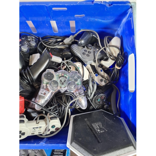 818 - A large collection of various game console controllers