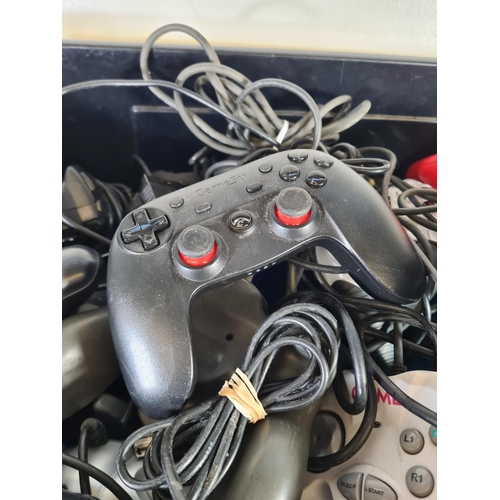 821 - A large collection of game console controllers