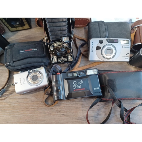 679 - A collection of cameras to include cased Ensign-Selfix 20 folding for 120 film, cased Kodak Retinett... 