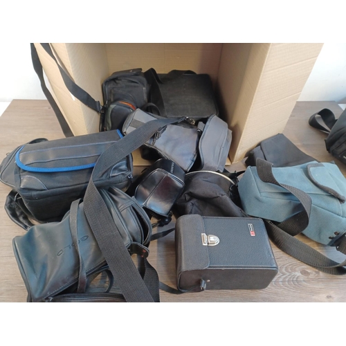 682 - Four boxes containing a large quantity of camera and cine equipment to include cased Halina Super8 c... 