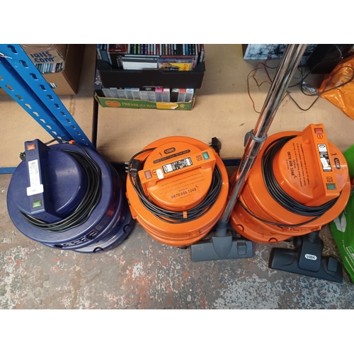 847 - Three Vax wet and dry vacuum cleaners with a selection of attachments