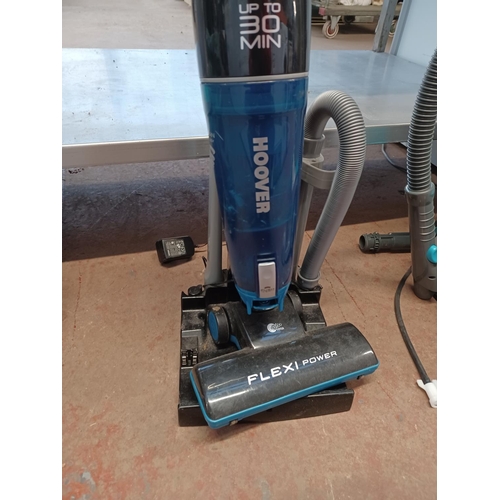 855 - A Hoover Flexi Power cordless bagless vacuum cleaner with charging station and attachments