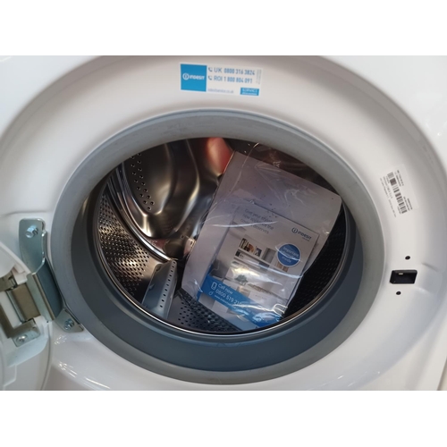 865 - an Indesit 7kg washing  machine with instruction manual - approx. 60cm wide