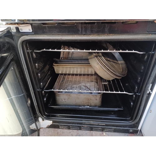 867 - A Beko DVC563 twin oven, four burner hob electric cooker - approx. 50cm wide