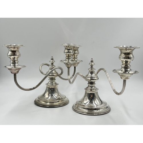 1245 - A pair of Elizabeth II Viner's Ltd. hallmarked Sheffield silver two branch candelabras, dated 1959 -... 