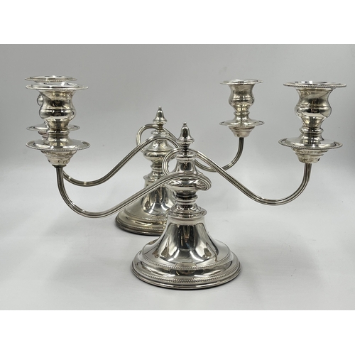 1245 - A pair of Elizabeth II Viner's Ltd. hallmarked Sheffield silver two branch candelabras, dated 1959 -... 