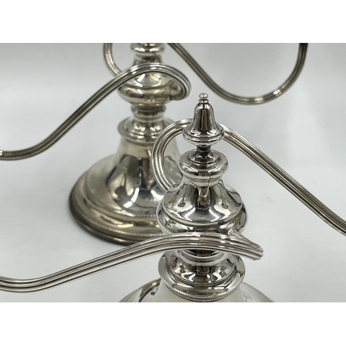 1245 - A pair of Elizabeth II Viner's Ltd. hallmarked Sheffield silver two branch candelabras, dated 1959 -... 