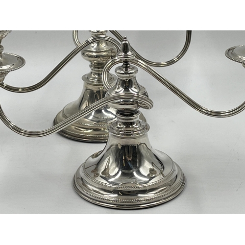 1245 - A pair of Elizabeth II Viner's Ltd. hallmarked Sheffield silver two branch candelabras, dated 1959 -... 