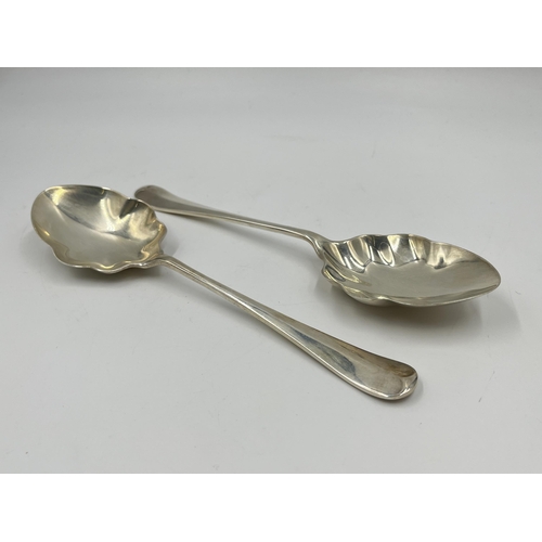 1247 - A cased pair of George V Walker & Hall hallmarked Sheffield serving spoons, dated 1934 - approx. gro... 