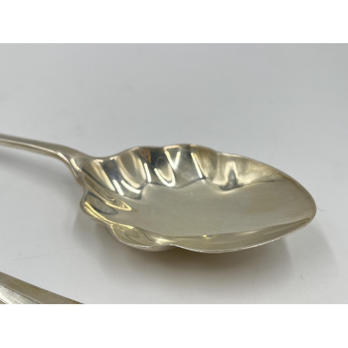 1247 - A cased pair of George V Walker & Hall hallmarked Sheffield serving spoons, dated 1934 - approx. gro... 