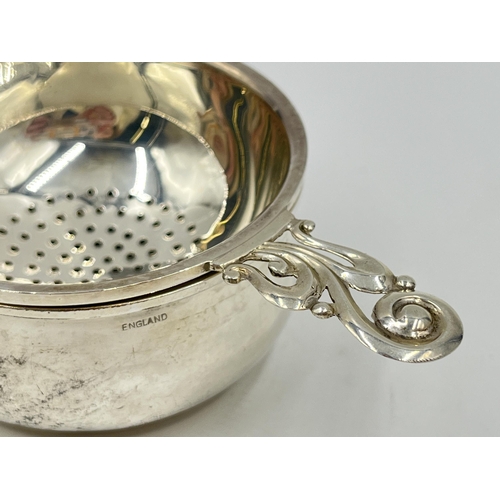 1249 - An Elizabeth II Henry Clifford Davis hallmarked Birmingham silver tea strainer, dated 1963 - approx.... 