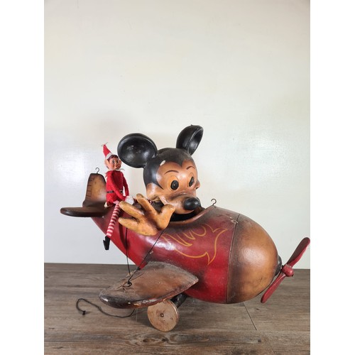 515 - A hand painted fibre glass model Mickey Mouse flying plane - approx. 53cm high