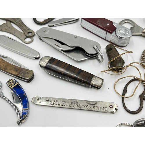 1237 - A collection of pocket knives, bottle openers and cigarette lighters