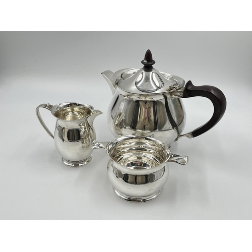 1238 - A 1960s Elkington & Co Ltd hallmarked Birmingham three piece tea set comprising teapot, milk jug and... 