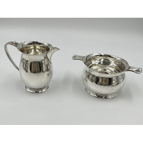 1238 - A 1960s Elkington & Co Ltd hallmarked Birmingham three piece tea set comprising teapot, milk jug and... 