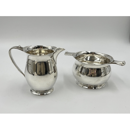 1238 - A 1960s Elkington & Co Ltd hallmarked Birmingham three piece tea set comprising teapot, milk jug and... 