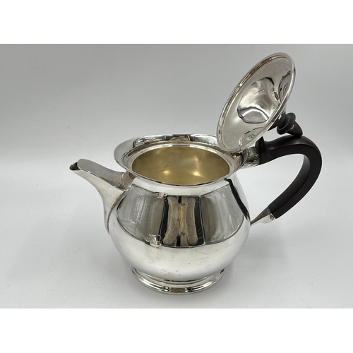 1238 - A 1960s Elkington & Co Ltd hallmarked Birmingham three piece tea set comprising teapot, milk jug and... 