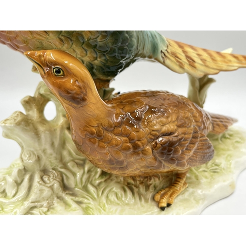 173 - A believed Echt Altmann ceramic pheasants figurine signed J. Stewarle - approx. 25cm high x 37cm lon... 