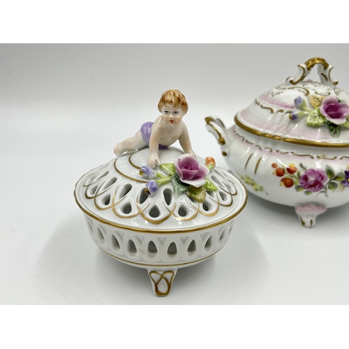 183 - Two pieces of Von Schierholz porcelain, pierced tri footed lidded circular trinket box and twin hand... 