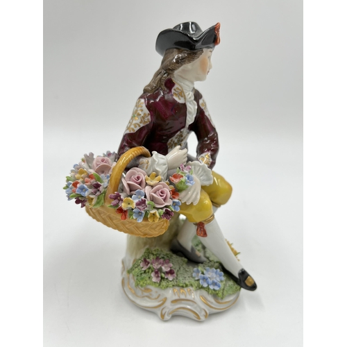 185 - A Sitzendorf hand painted porcelain gentleman flower seller figurine - approx. 14cm high