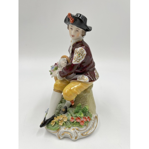 185 - A Sitzendorf hand painted porcelain gentleman flower seller figurine - approx. 14cm high