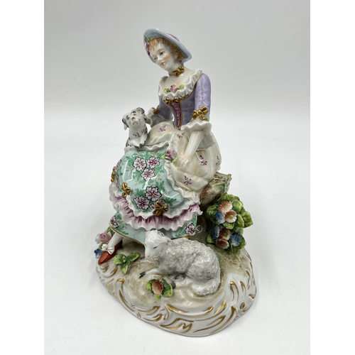 188 - A Sitzendorf hand painted porcelain figurine of a lady with dog and sheep - approx. 15cm high