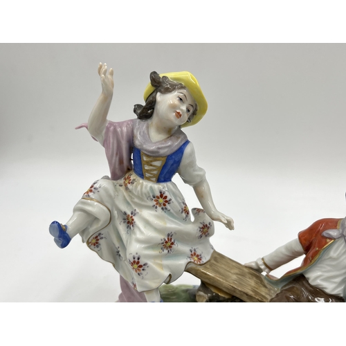 190 - A Volkstedt hand painted porcelain group figurine of two children on seesaw - approx. 15.5cm