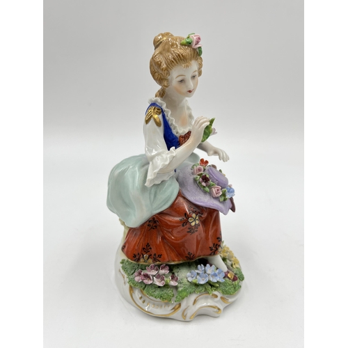 192 - A Sitzendorf hand painted porcelain figurine of a lady with hat - approx. 14cm high