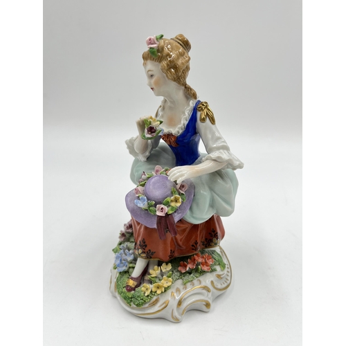 192 - A Sitzendorf hand painted porcelain figurine of a lady with hat - approx. 14cm high