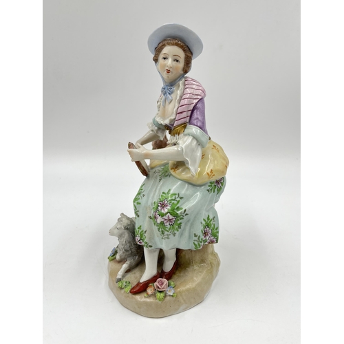 194 - A Sitzendorf hand painted porcelain figurine of a lady with tambourine and sheep - approx. 19.5cm hi... 