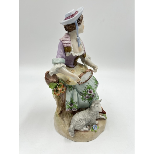 194 - A Sitzendorf hand painted porcelain figurine of a lady with tambourine and sheep - approx. 19.5cm hi... 