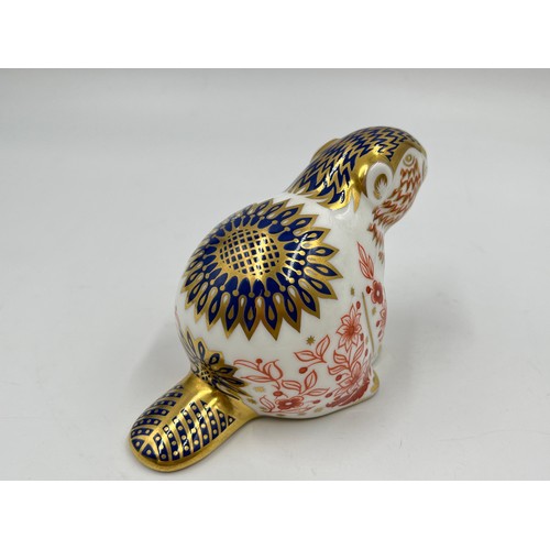 264 - A Royal Crown Derby Beaver paperweight with gold stopper