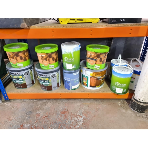 Twelve tins of paint to include Wilko smooth finish magnolia, Ronseal