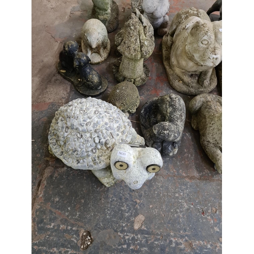 896 - A collection of garden ornaments, twelve cast stone and two fibreglass