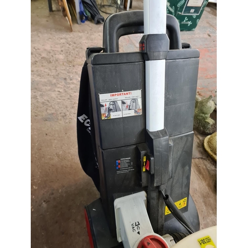 897 - An Eckman PLB1 2 stroke petrol leaf vacuum with instruction manual