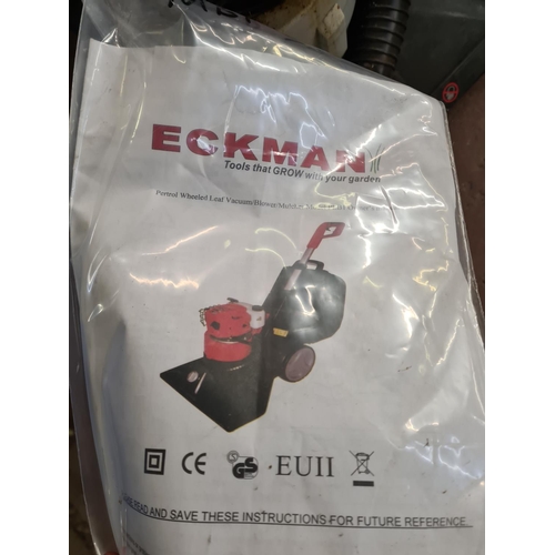 897 - An Eckman PLB1 2 stroke petrol leaf vacuum with instruction manual